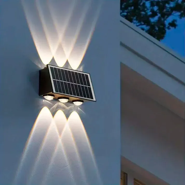 Aplique solar de 6 luces iluminando una pared hacia arriba y hacia abajo